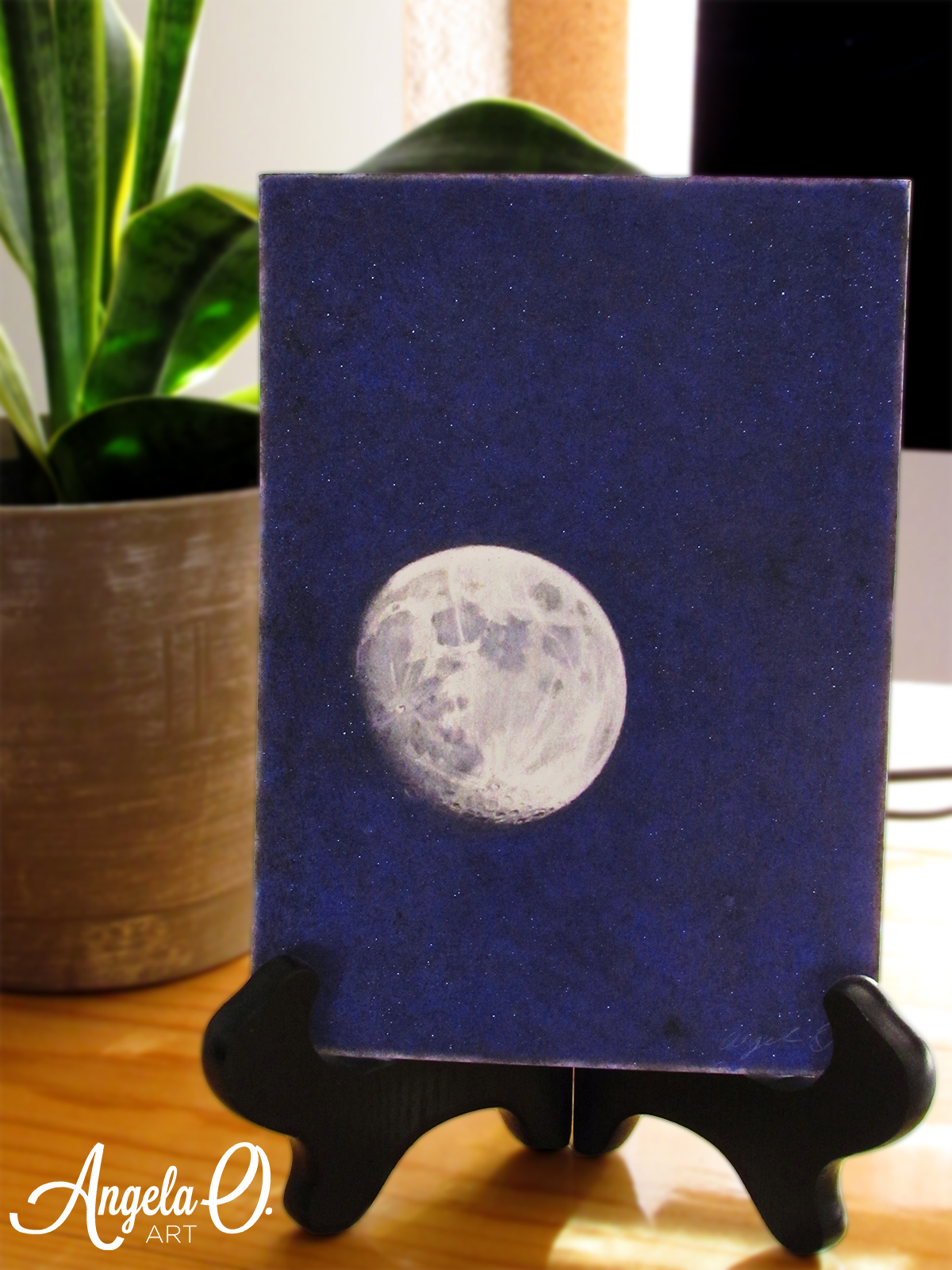 Moon drawing on an easel.